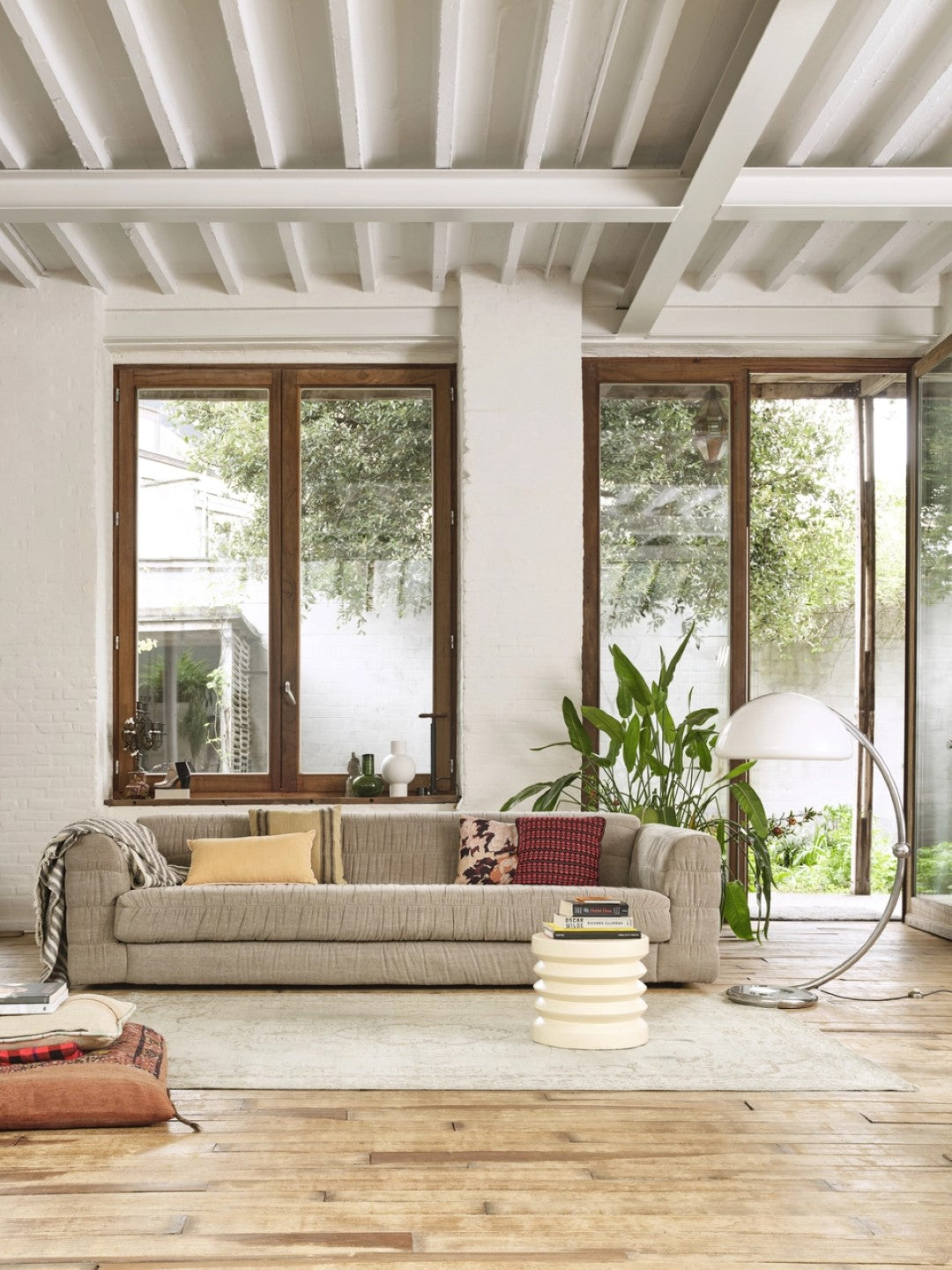 contemporary style club couch in a taupe color fabric that is a mix of linen and cotton