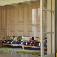 lounge sofa with different shape, textured and colored lumbar and throw pillows