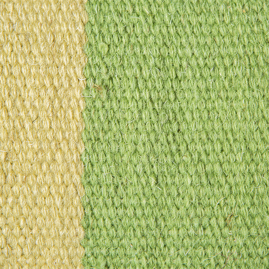 detail of light and darker green handwoven wool 