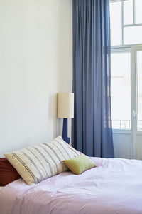 bedroom with blue lamp and natural cotton thin striped super large pillow