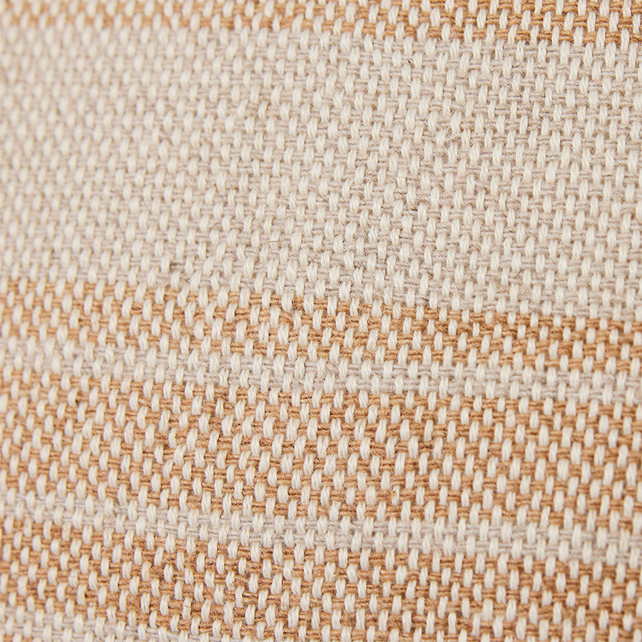 close up of textured woven fabric in brown hues