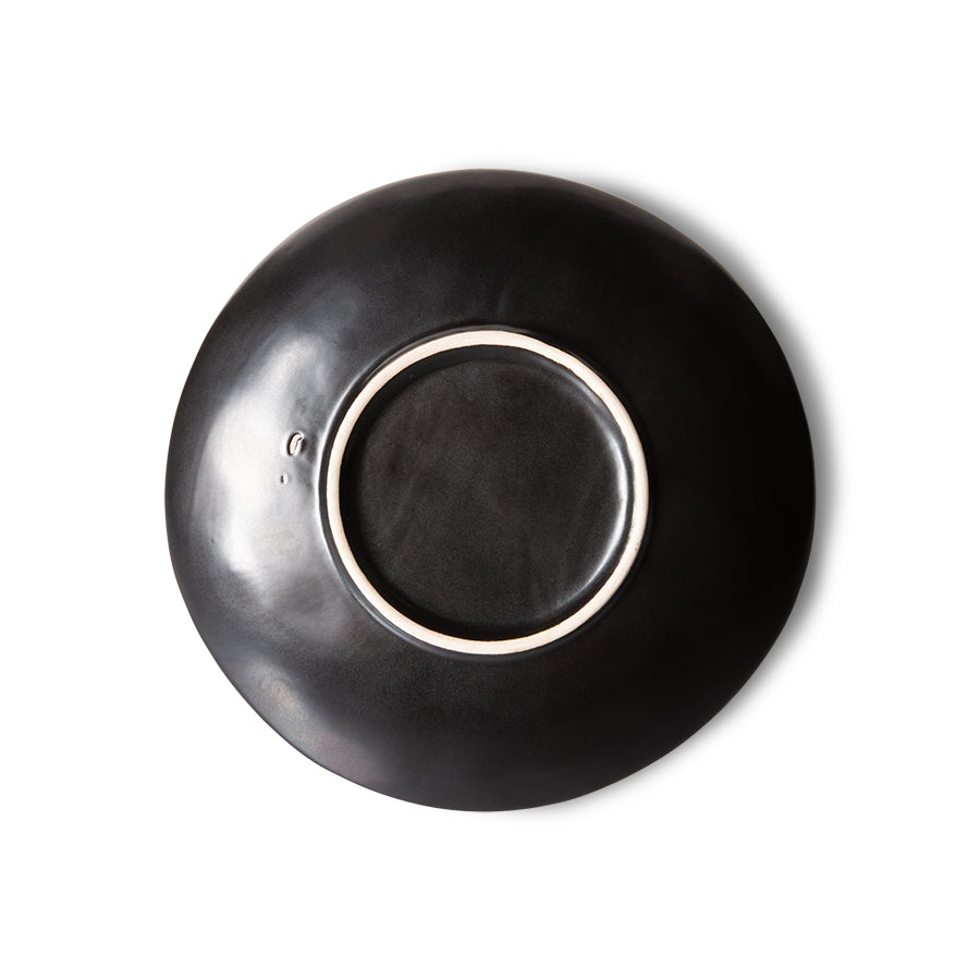 back of black stoneware appetizer or dessert plate with star pattern