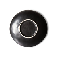 back of black stoneware appetizer or dessert plate with star pattern