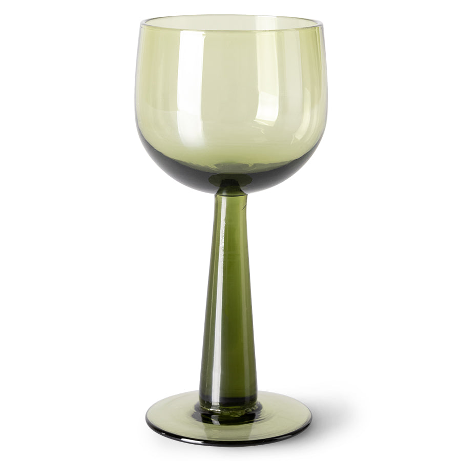 green colored wine glass on tall stem
