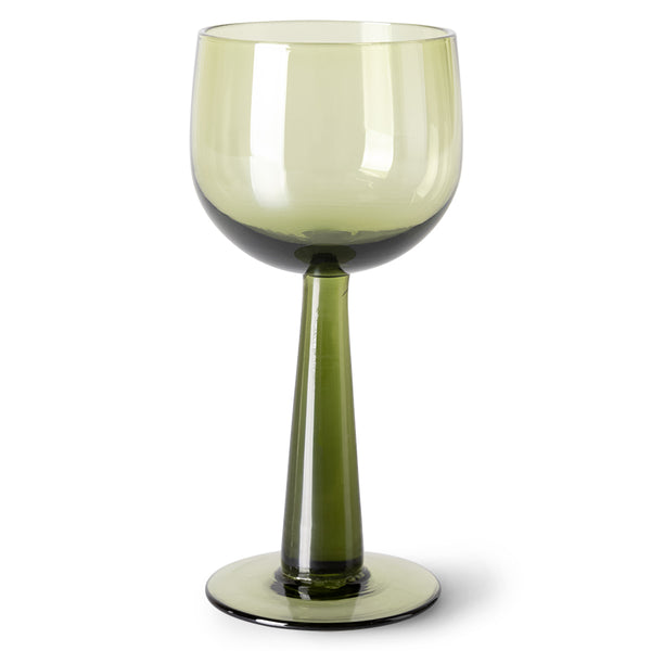 green colored wine glass on tall stem