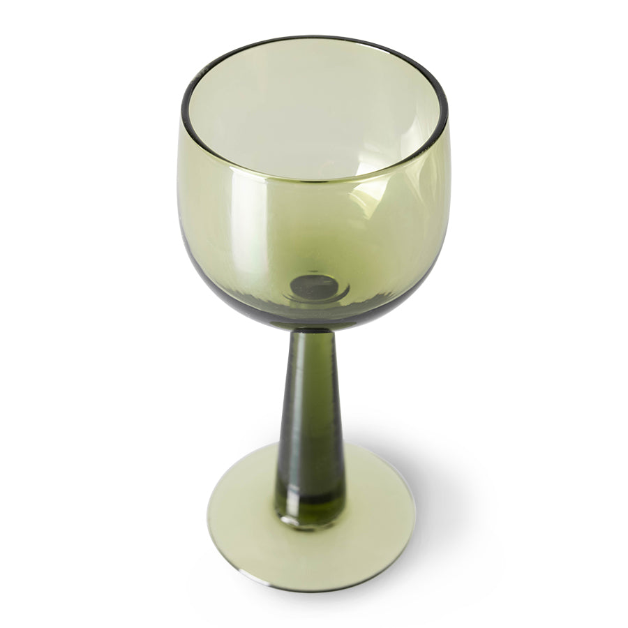 green colored wine glass on tall stem