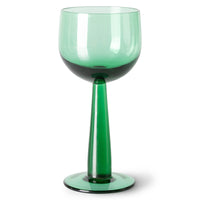 green colored tall stem wine glass