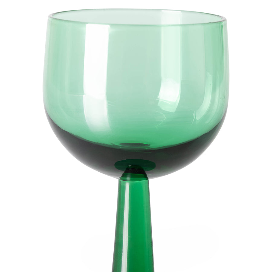 green colored tall stem wine glass