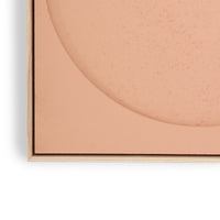 detail of peach colored art panel with texture made from felt