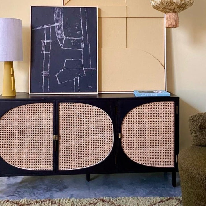 close up of sideboard with cane webbing detail doors