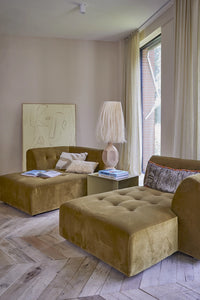 day bed in velvet with olive green metal side table and sand colored boho style table lamp with real abaca strings shade