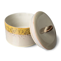 brown, yellow and cream colored cookie jar with lid