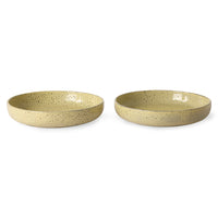 two yellow speckled deep paste plates