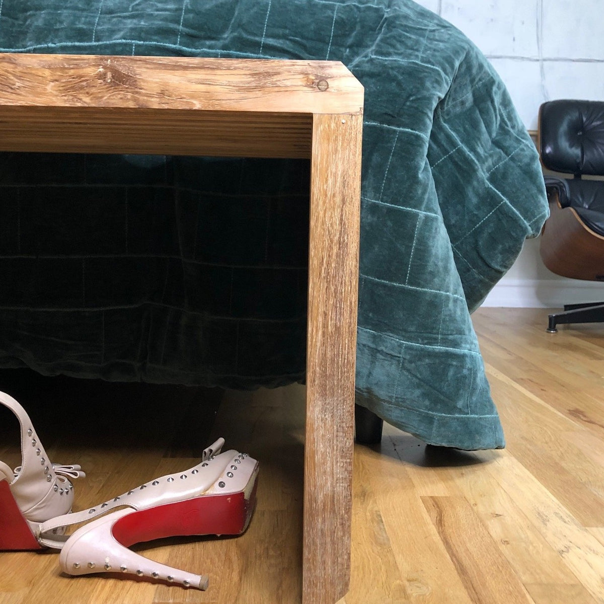 front of natural slatted teak wood bench