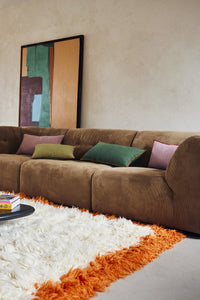 brown corduroy element couch with pink and green lumbar pillows in two sizes