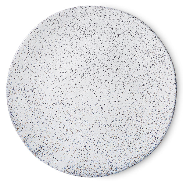 front view of organic shaped dinner plate in white with grey speckles