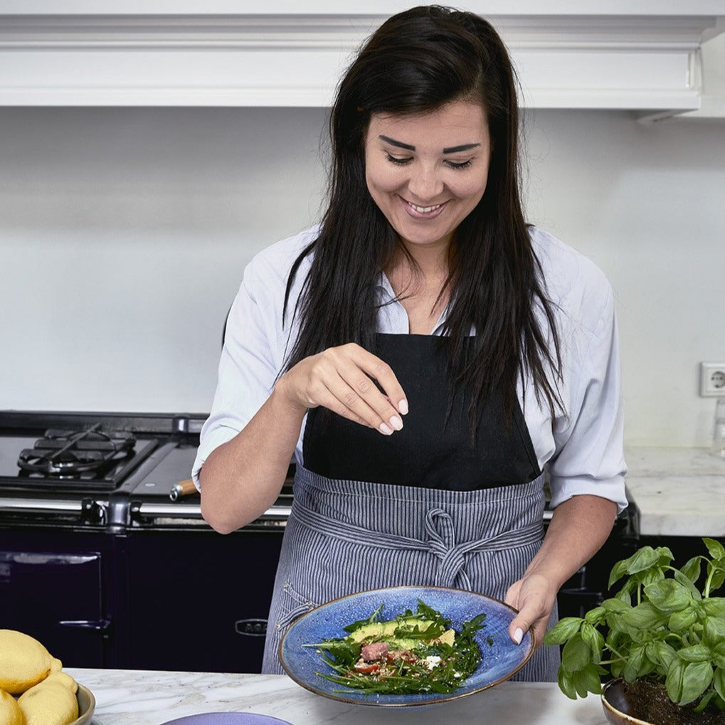 blue pasta plate with green salad