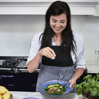 blue pasta plate with green salad