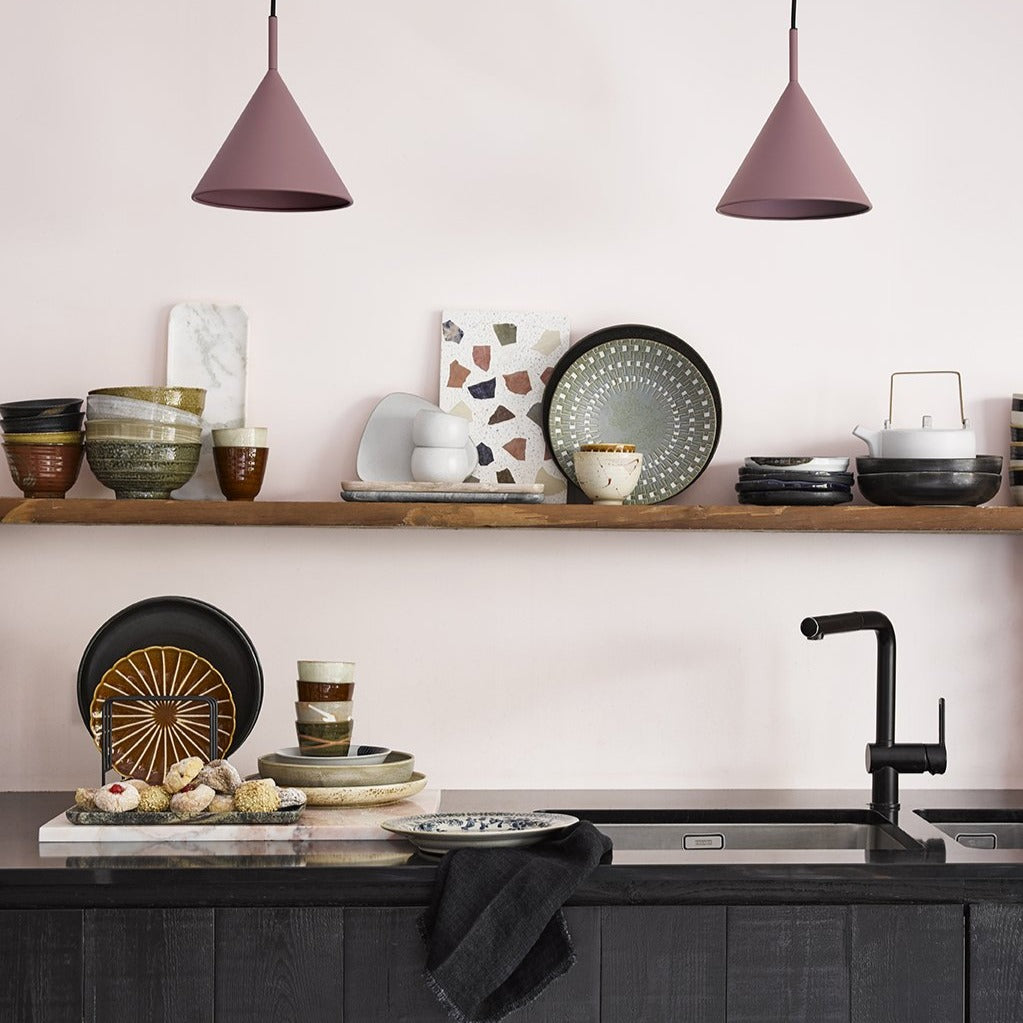kitchen with open shelving and ceramic plates bowls and cups