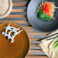 brown and black Kyoto style dinner plates with fresh food