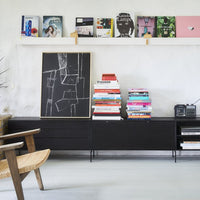 black abstract painting on black media console