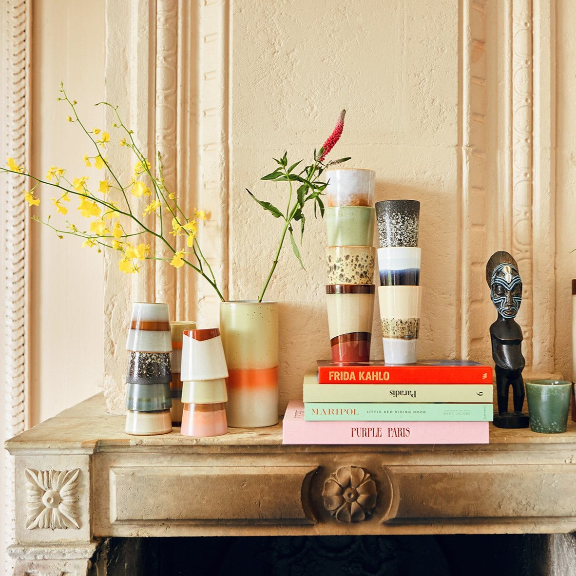 fir mantel with retro inspired stoneware cups and mugs
