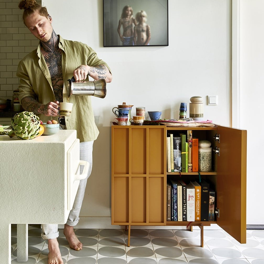 orange small sideboard with storage jar reef on top