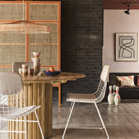 dine in kitchen in retro style with teak wooden table and white metal chairs