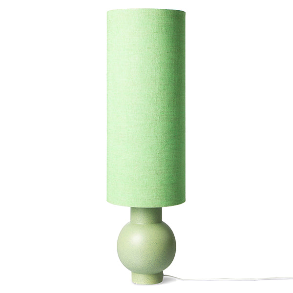 table lamp with stone ware base and linen shade in green tones