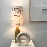 printed lampshade with a yellow base with handles