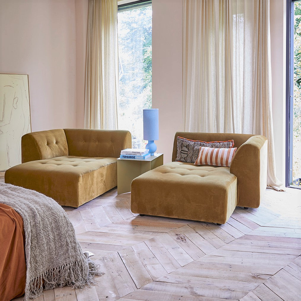 bedroom seating area with striped accent pillow in sectional
