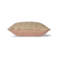 blush colored pillow with silver trim and glass beads sewed on