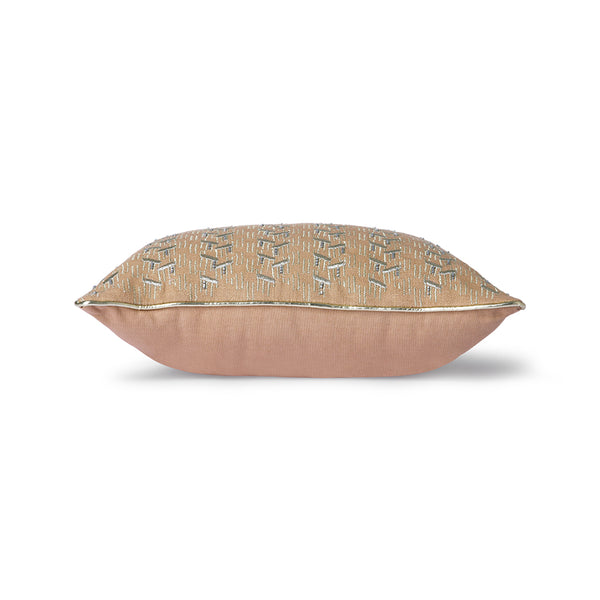 blush colored pillow with silver trim and glass beads sewed on