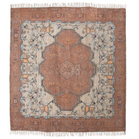 square area rug with fringes and muted colors